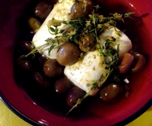 Goat cheese with olives, lemon zest and thyme